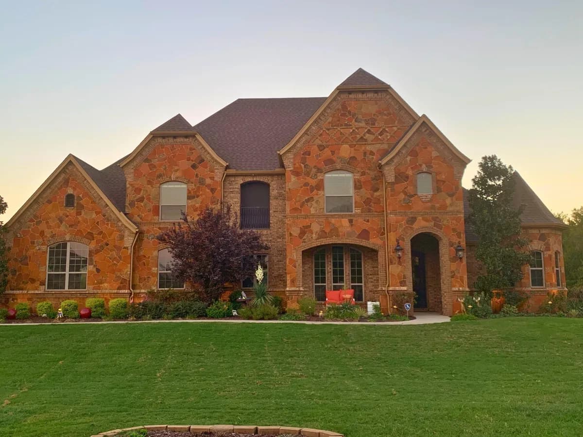 Brick home exterior in the Rockwall area with replacement windows