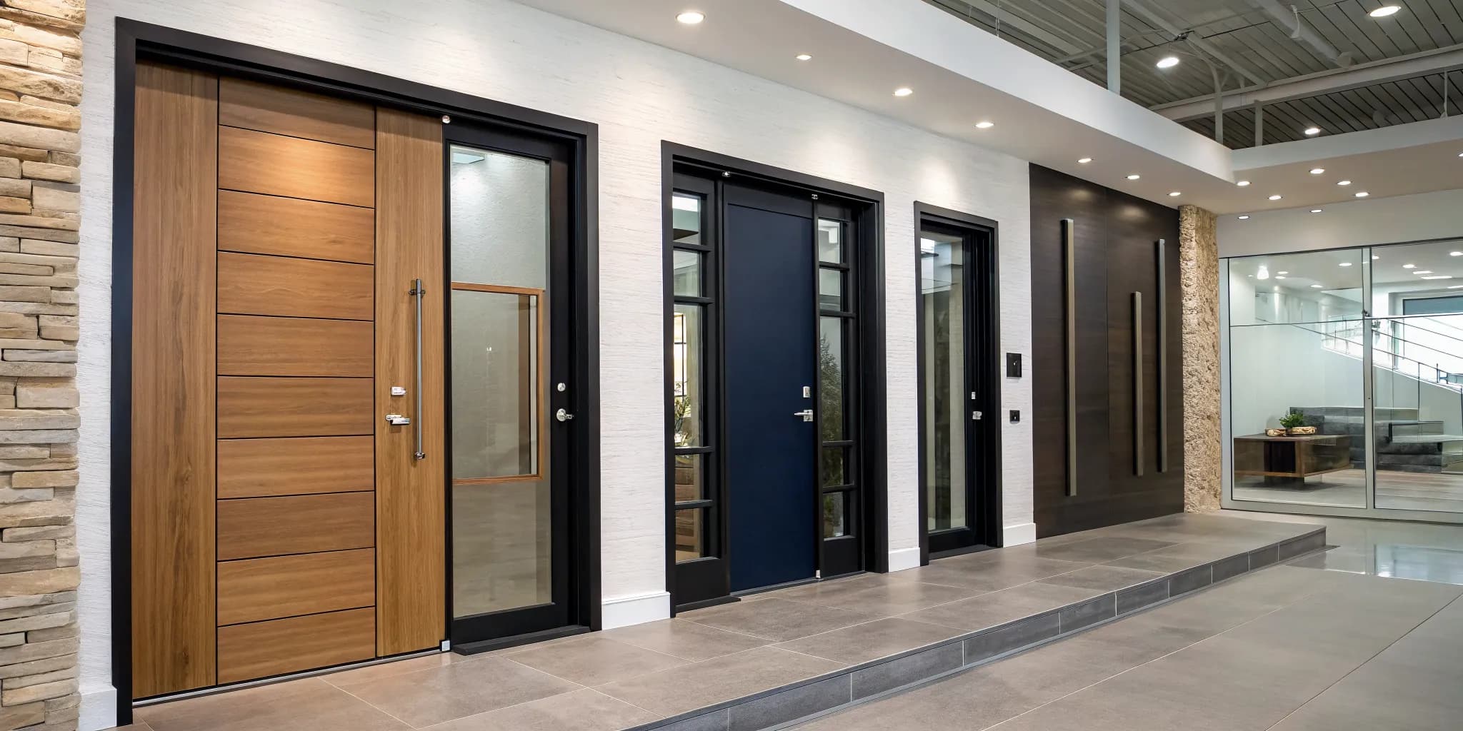 Modern entry doors in wood, steel, and fiberglass on display in a showroom.